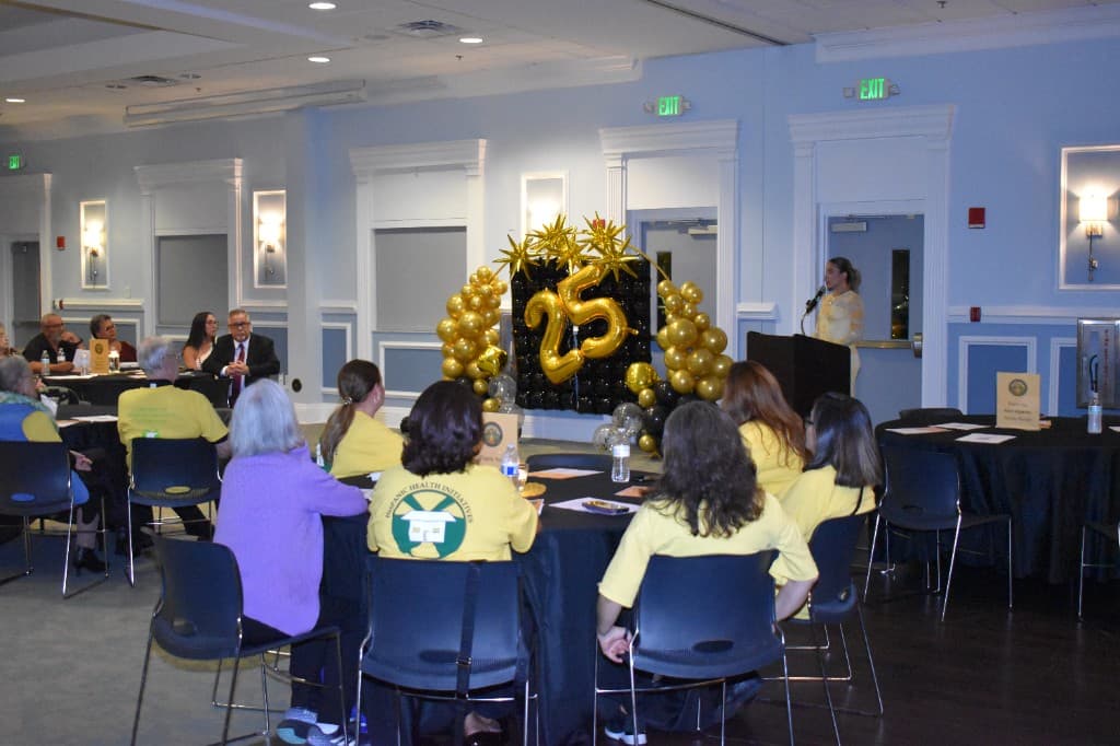 Guests seated at tables during the HHI 25th anniversary celebration