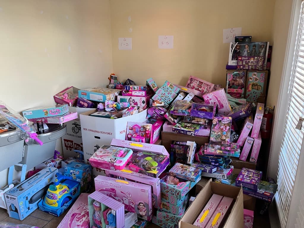 Community members dropping off holiday gifts at the Toys for Tots collection site