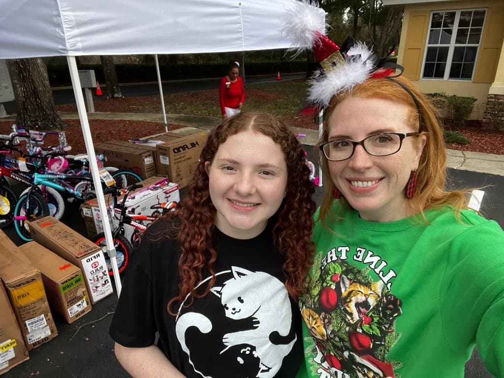Indoor toy drive room with pink and colorful gift boxes sorted for families